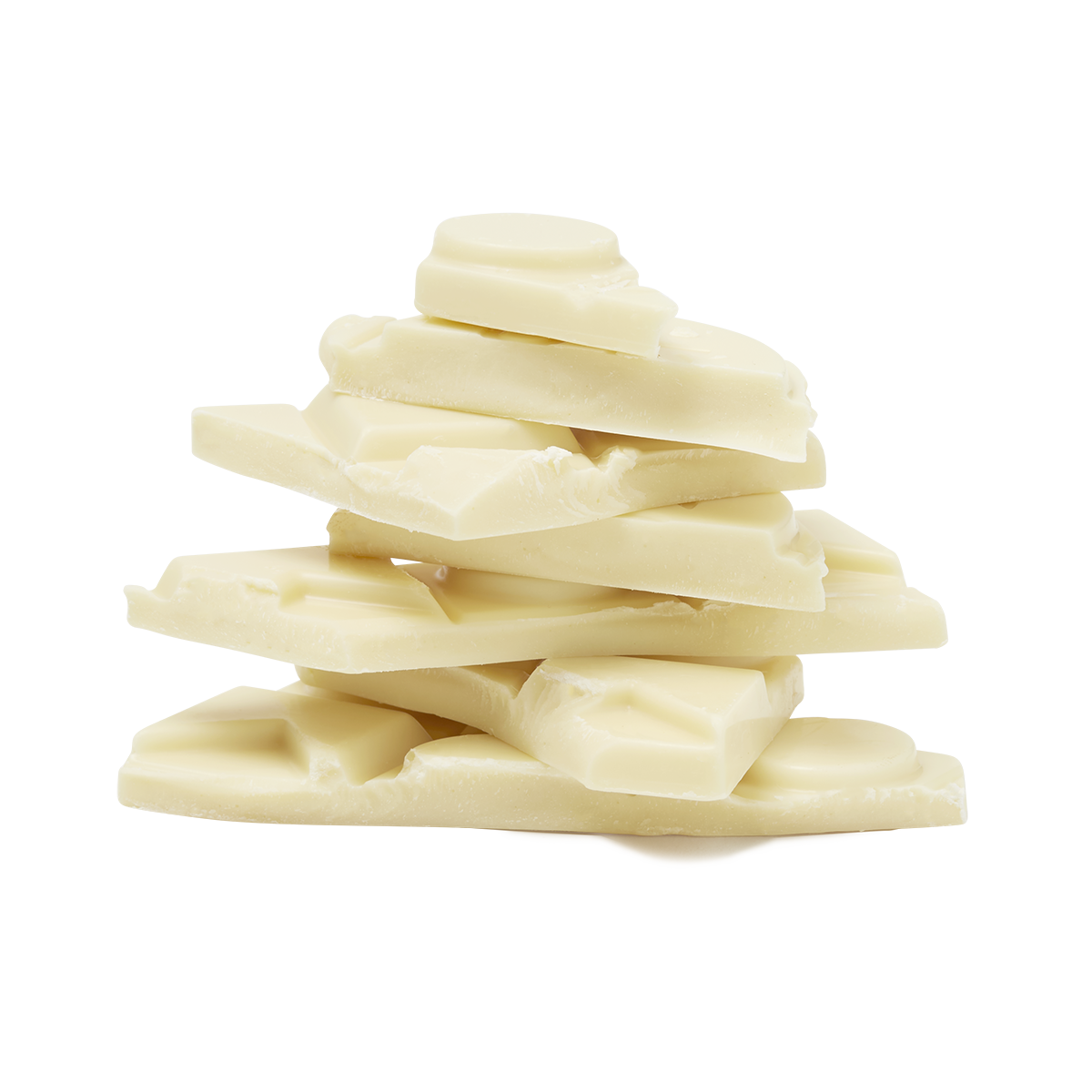 Broken white chocolate pieces stacked together