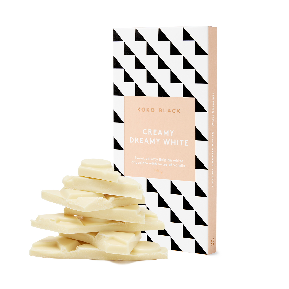 White chocolate pieces in front of chocolate block