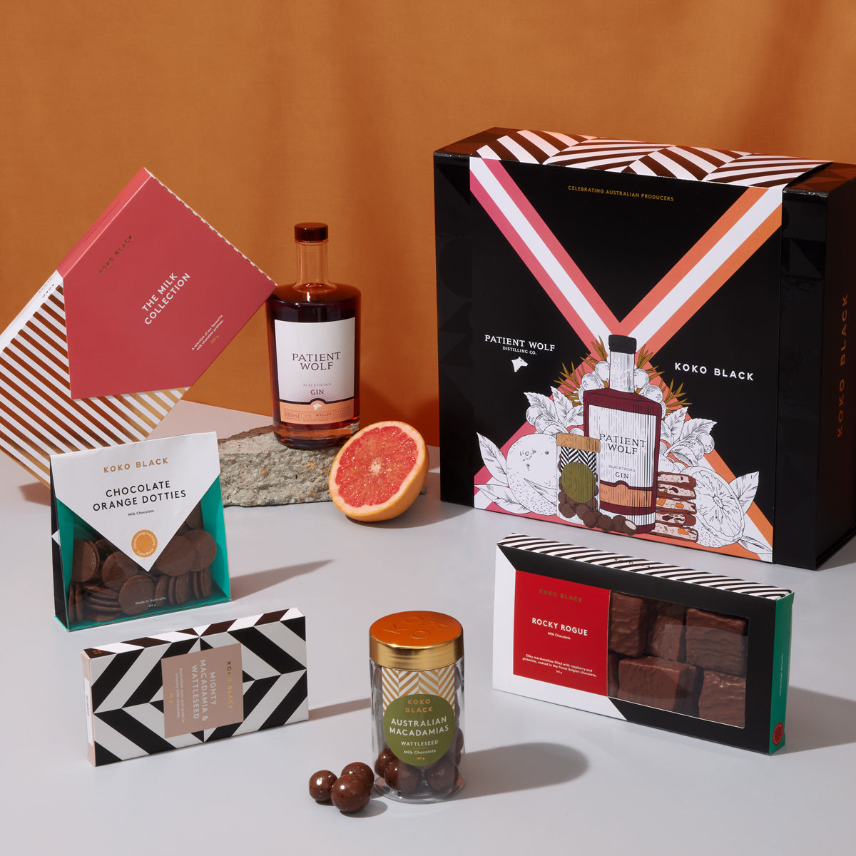 Assortment of milk chocolate in front of gin bottle