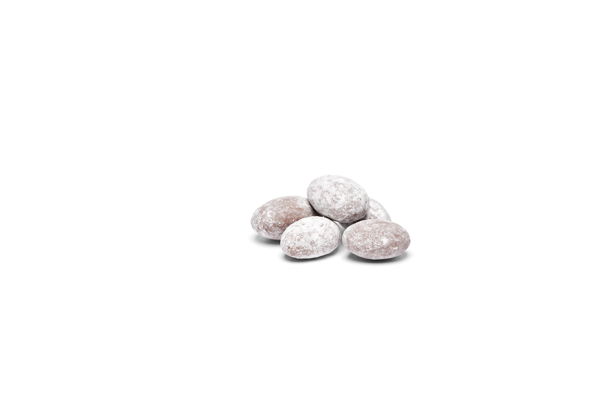 Dusted almonds stacked together