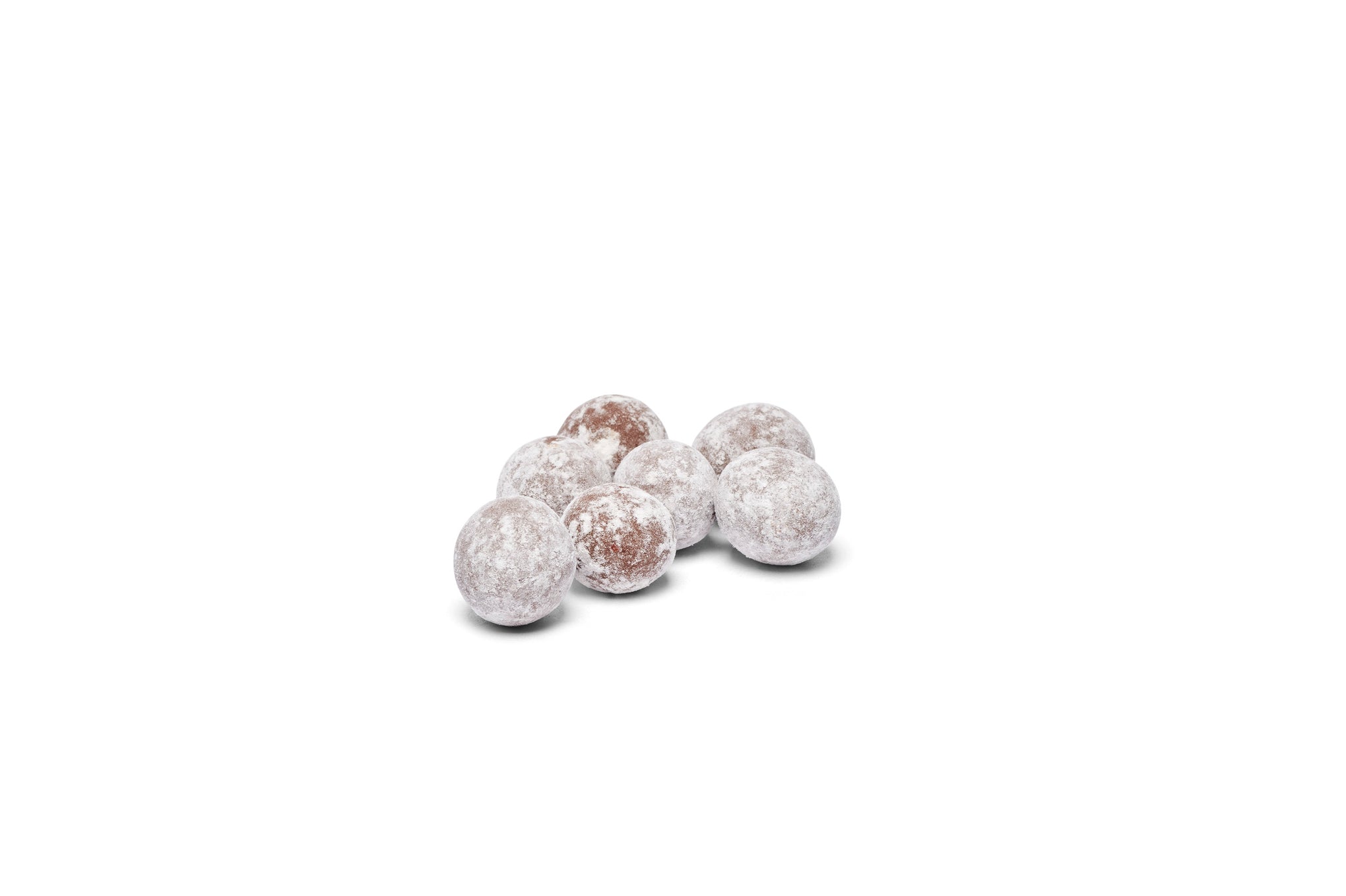 Chocolate dusted hazelnuts placed together